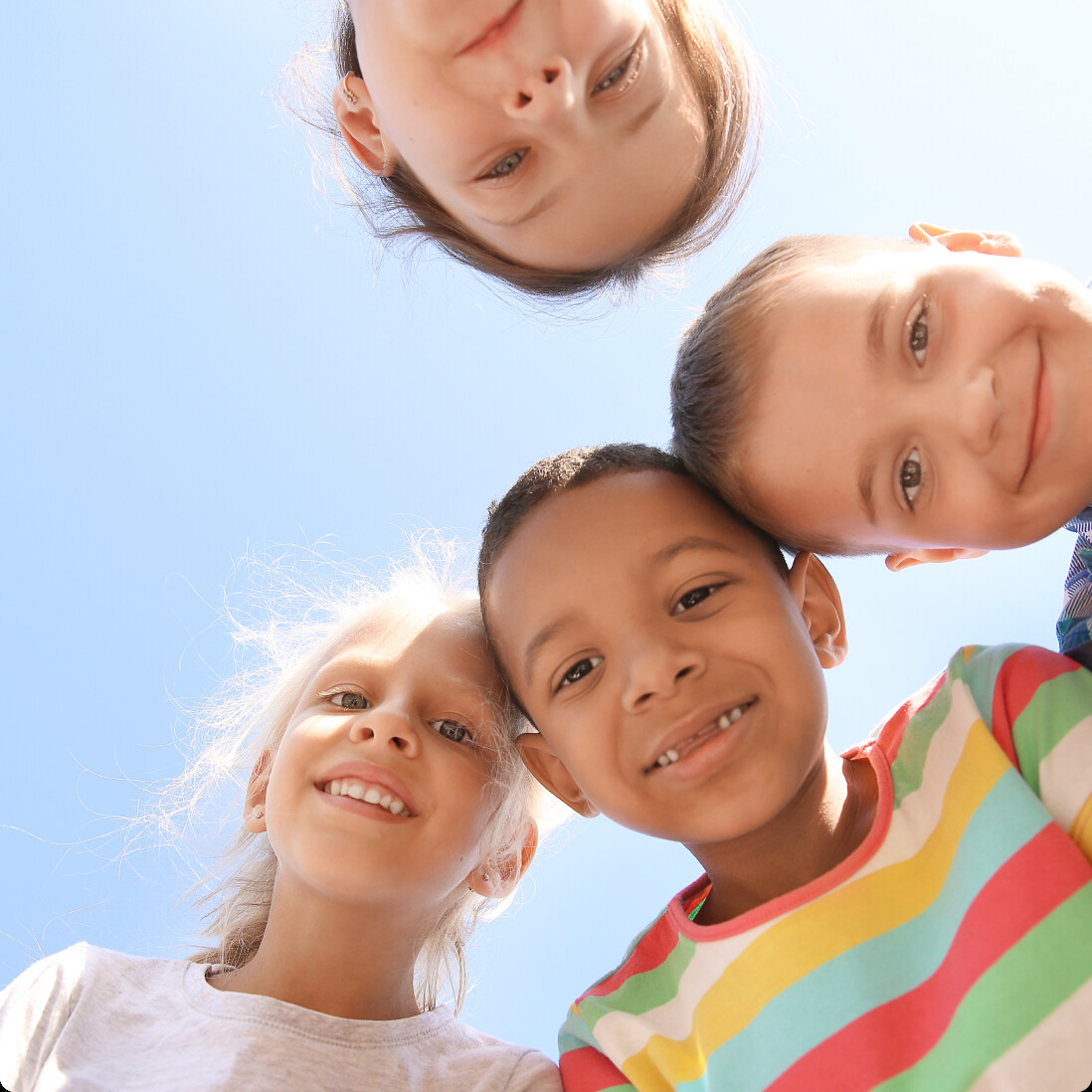 Children smiling together outdoors